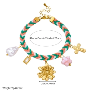 Detail showing dimensions of a colorful woven bracelet with various gold-plated charms
