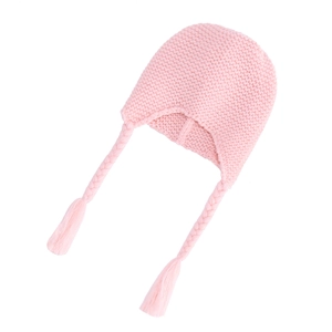 Detailed knit texture of pink baby earflap hat with braided straps and tassels