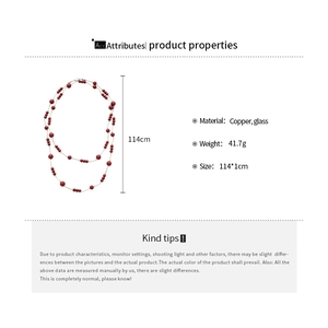 Long red beaded necklace details with dimensions 114cm length and copper glass materials