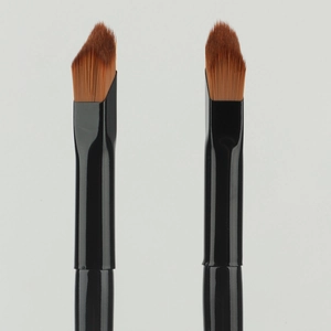 Angled concealer and contour brush with synthetic brown bristles and black handle