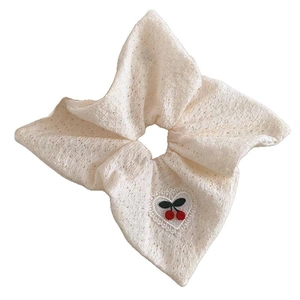 Creamy lace scrunchie with sweet cherry embroidery and delicate heart-shaped borders
