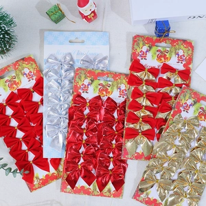 Close-up of 12-piece Christmas bow sets in gold and red for tree decoration