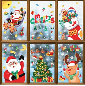 Detailed view of Christmas window clings with Santa, reindeer and snowflakes on glass