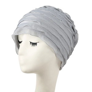 Breathable light grey slouchy beanie hat for women featuring layered pleats on white model