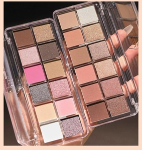 Macro shot of two ten-color acrylic eyeshadow palettes with matte and shimmer textures
