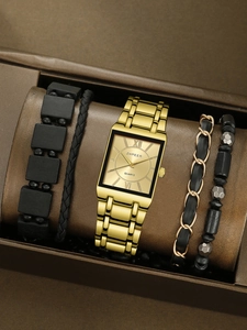 Detail view of a gold square business watch and black bracelet set in a gift box