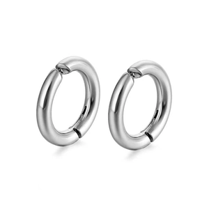 Detail of high-polished silver titanium steel hoop earrings with glossy finish