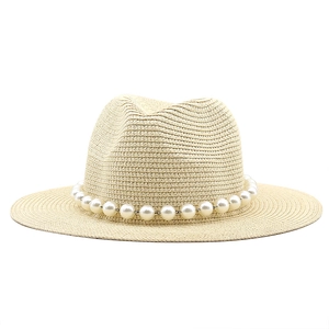 Detail of classic straw sun hat featuring a sophisticated white pearl chain embellishment
