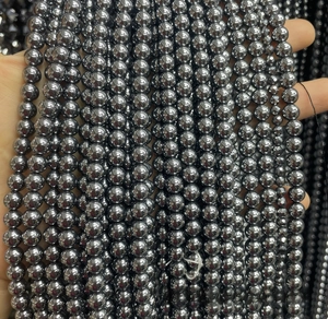 Close-up of faceted terahertz beads with metallic grey luster for DIY jewelry