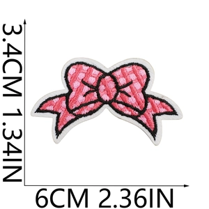Macro view of pink embroidered butterfly patch showing detailed stitching and size dimensions