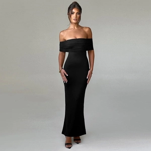 Detail of the elegant black off-shoulder maxi dress with ruched bodice and slim fit design
