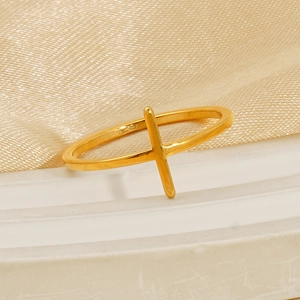 Minimalist 18K gold-plated stainless steel cross ring for women on silk background