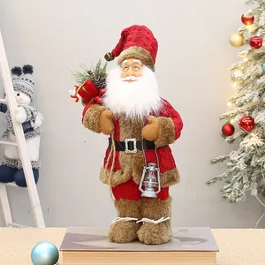 Close-up of Santa doll with red knit outfit, plush fur trim, and silver lantern