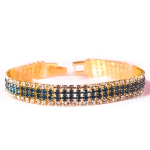 Elegant gold-plated bracelet with rows of blue and clear crystals for weddings