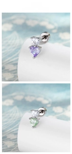 Macro shot of candy-colored heart zirconia stud earrings in purple and green hues