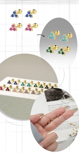 Macro detail of S925 silver clover studs with colorful zircon and ball screw back