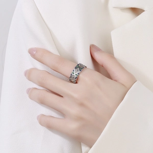 Detail of s925 silver ring featuring blue and green zircon stones in geometric design