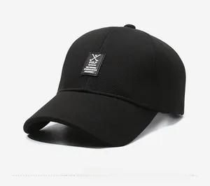Detail view of the breathable fabric texture and GOLF embroidery on the black baseball cap