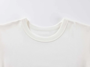 Close-up of ribbed crew neck collar and double-needle stitching on white modal sports tee