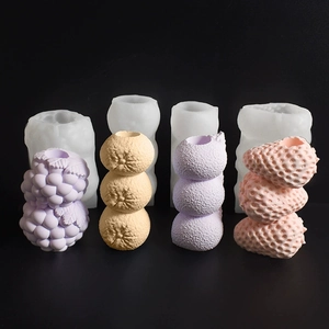 Dettaglio dello stampo in silicone per candele alla frutta con texture fragola e arancia
