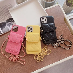 Quilted leather crossbody phone case with gold chain strap in pink, yellow and black