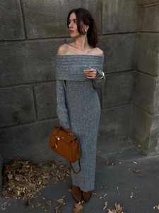 Detail shot of grey off-shoulder knitted dress showing ribbed texture and bodycon fit