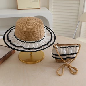 Detail of summer straw hat and crossbody bag set with white pleated chiffon lace trim