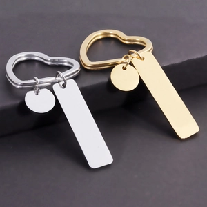Customizable silver and gold stainless steel keychains with heart rings and pendants
