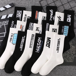 Streetwear cotton socks in black and white with graphic lettering and ribbed cuffs