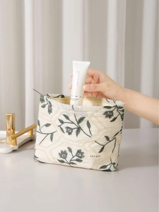 Quilted floral embroidery cosmetic bag made of cotton linen for skincare storage