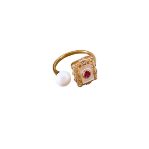 Vintage gold plated ring with white pearl and red gemstone in square frame