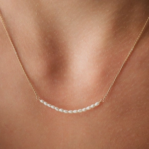Elegant s925 silver necklace with golden chain and white freshwater seed pearls