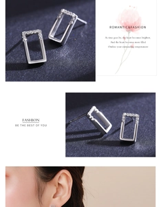 Detail view of rectangular 925 sterling silver stud earrings with pavé set crystals