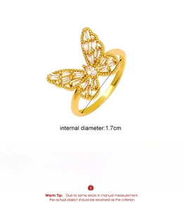 Detail of gold butterfly ring with zircon wings showing measurements and alloy material