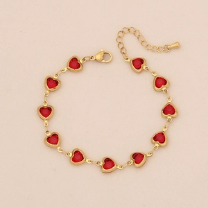 Elegant gold-tone stainless steel bracelet featuring eleven red heart-shaped crystals