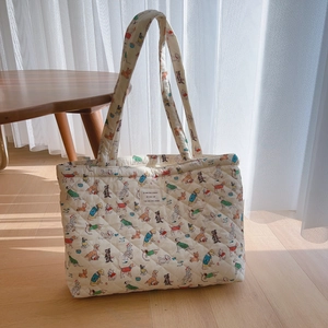 Quilted cotton tote bag with vintage puppy prints and soft top handles for daily use