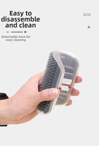 Detailed view of the detachable silicone cat grooming brush for easy cleaning and maintenance
