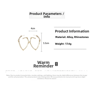 Detailed view of golden bamboo earrings with rhinestones measuring 4cm wide and 5.5cm long