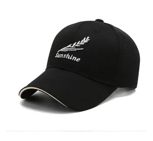 Detail of black mesh baseball cap with white Sunshine embroidery and breathable back