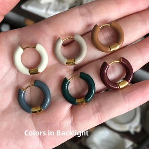 Detail of six colors enamel hoop earrings in 18K gold plated stainless steel