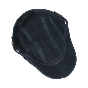 Detailed interior of cotton newsboy cap showing stitching and 100% cotton wash label