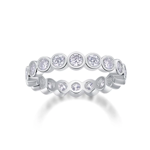 Macro shot of silver S925 ring with moissanite eternity band and sparkling round stones