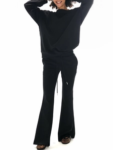 Black two-piece sweatshirt set featuring a long sleeve top and high waist flared trousers