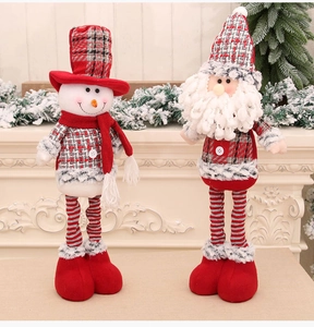 Detail of plush Santa and Snowman dolls in red grey plaid fabric for Christmas decor