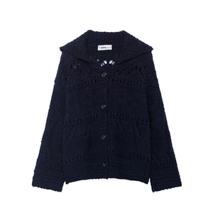 Detail of navy blue hollow knit cardigan collar with buttons and brand label
