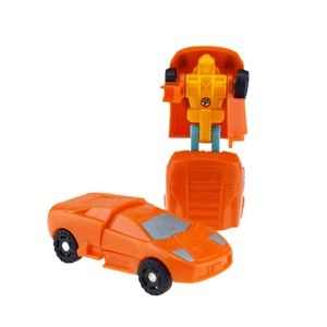 Detailed view of the orange construction vehicle toy transforming into a sleek robot