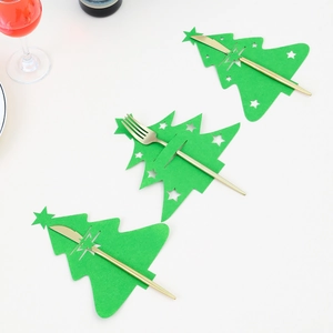Flat lay of green Christmas tree felt cutlery holders with golden knives and forks