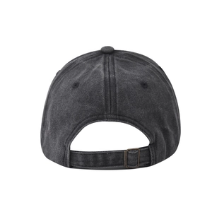 Detail of adjustable metal buckle and vintage washed cotton fabric on baseball cap