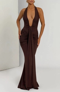 Detail of elegant backless halter dress featuring pleated texture and dark coffee brown fabric
