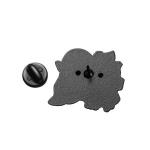 Macro view showing the black textured metal back of the pin with a rubber clutch